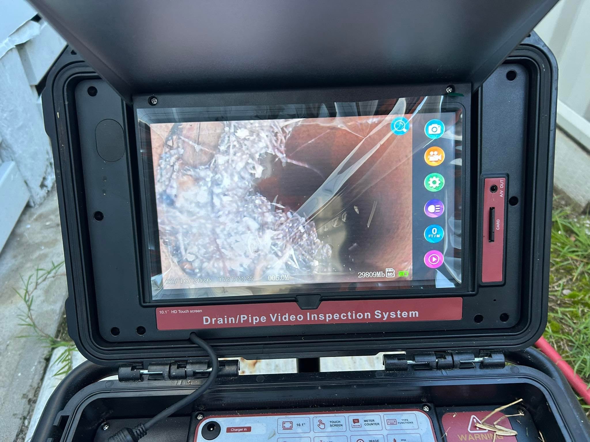 CCTV drain camera reel and monitor set up for a drain inspection