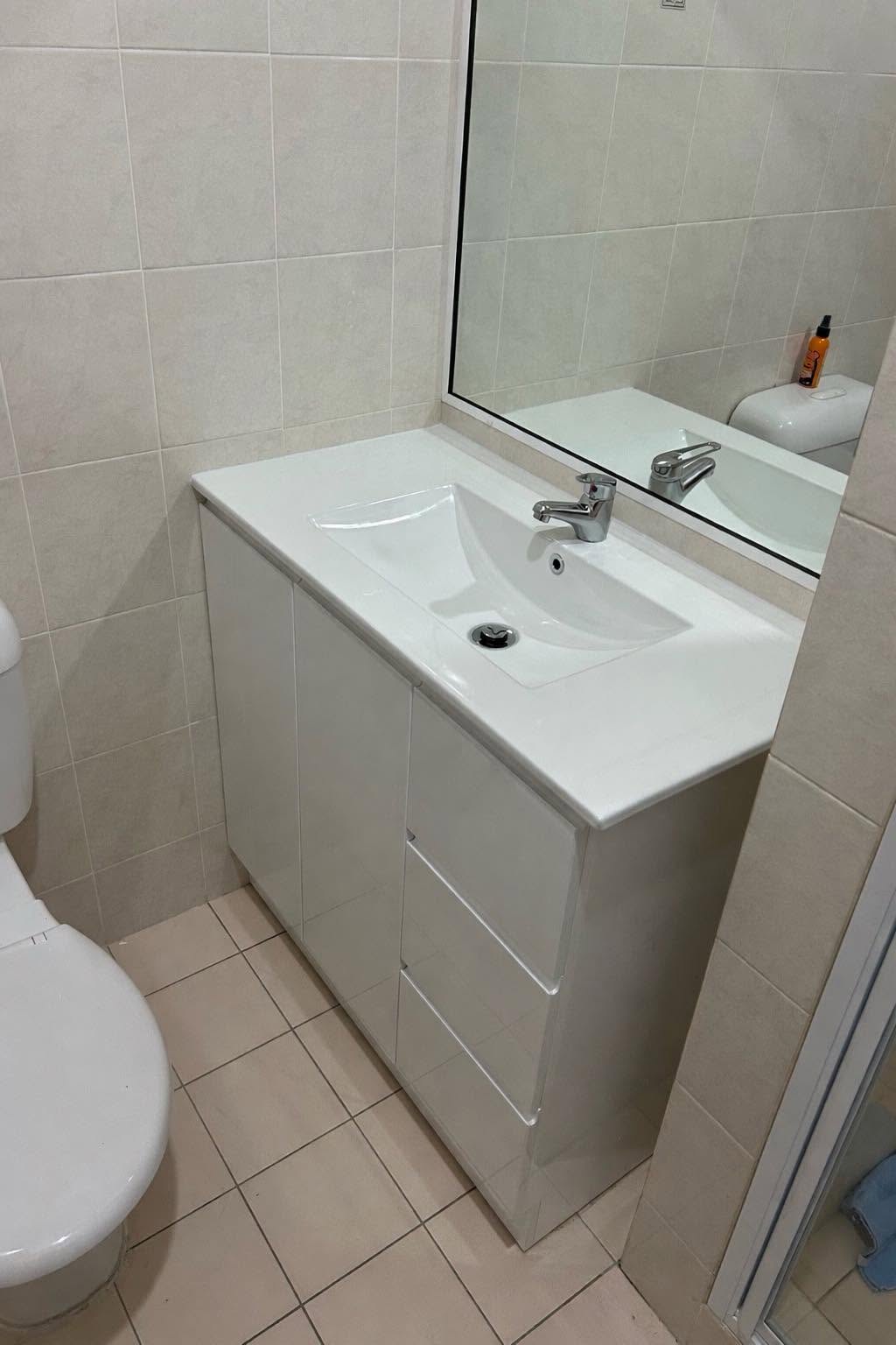 Bathroom vanity with new tapware and connected water supply