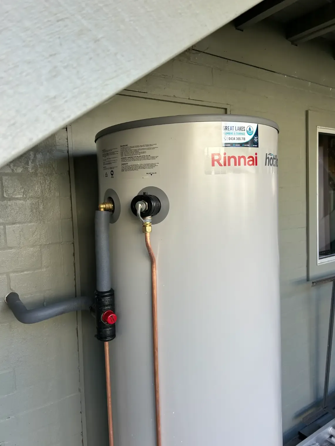 Rinnai hot water cylinder installed beneath an exterior structure